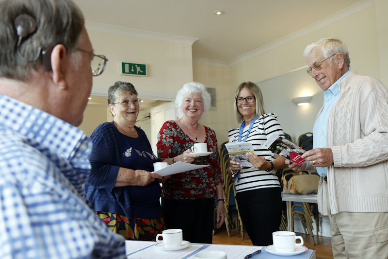 Marie and Phil with three fello wOddfellws members stood talking and having tea