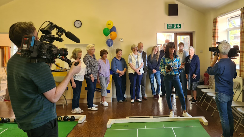 Two camera operators filming during an Oddfellows event