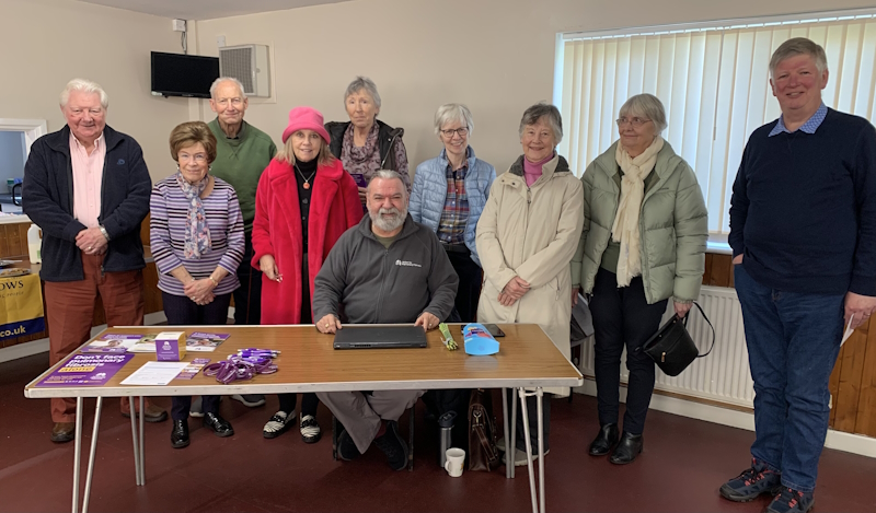 Members join a speaker from the charity