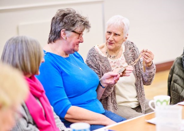 Dorothy at an Oddfellows coffe morning, showing her silver medal to members