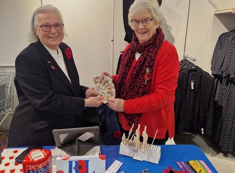Handing over the cash donation to the Royal Legion
