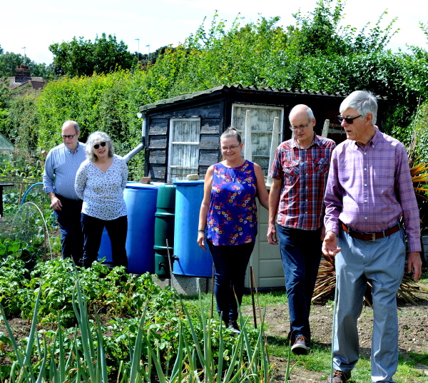 John and four of his Oddfellows friends walking around his allotment