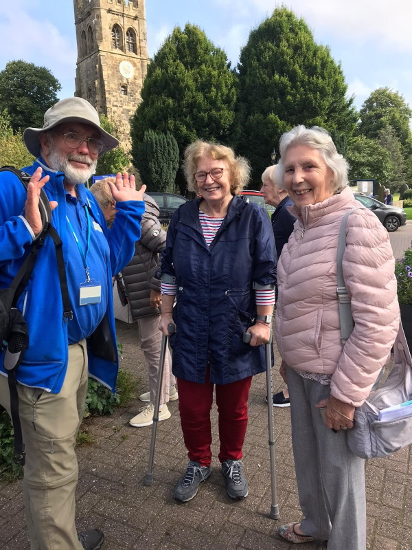 HF Holidays guide with two female Oddfellows members in Tideswell