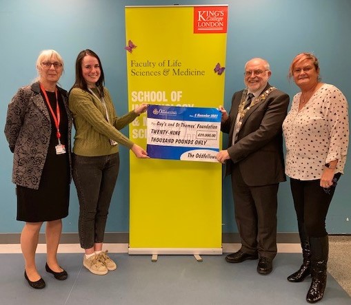 Professor Jo Spencer and Bekki Velounias receiving the cheque from David Ogden and Jane Nelson