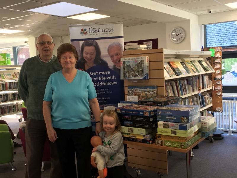 David and Christine Saunders at the library seling and swapping jigsaws