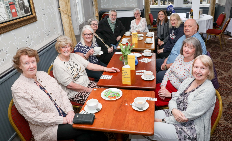 Val rider sat with her 10 friends having afternoon tea at an Oddfellows social event