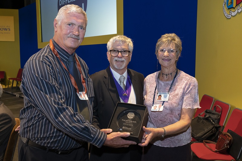 Doug and Phyllis's relatives accepting their award