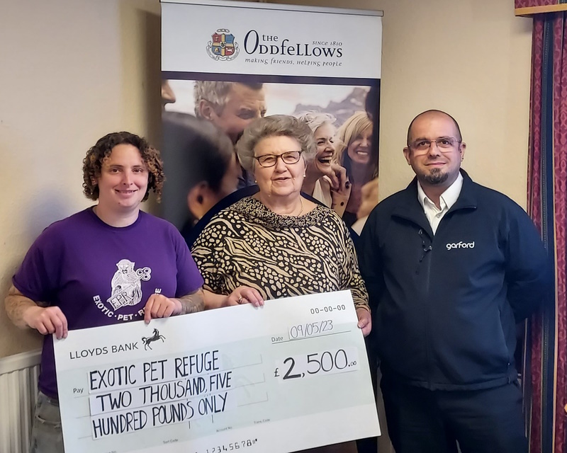 Caz Bruce, Elaine Brown and Darren Mansford hold a cheque for £2,500 for the Exotic Pet Refuge