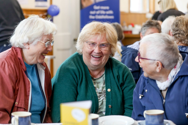 Three women smling and laughing together