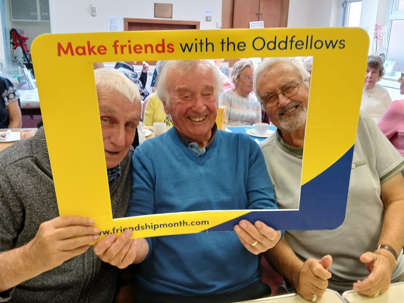 Three men smiling and laughing