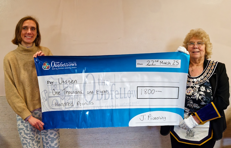 Handing over the big cheque to the charity Unseen