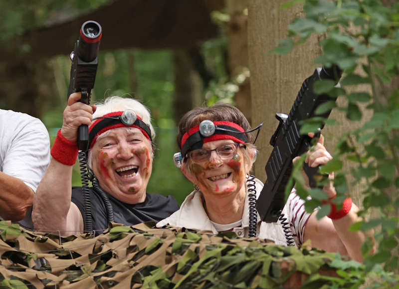 Two Members Playing Laser Combat And Saying Yes To New Shared Experiences