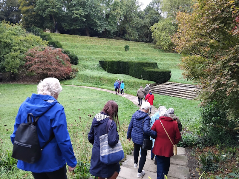 Nine members on a tour of some lanscaped gardens