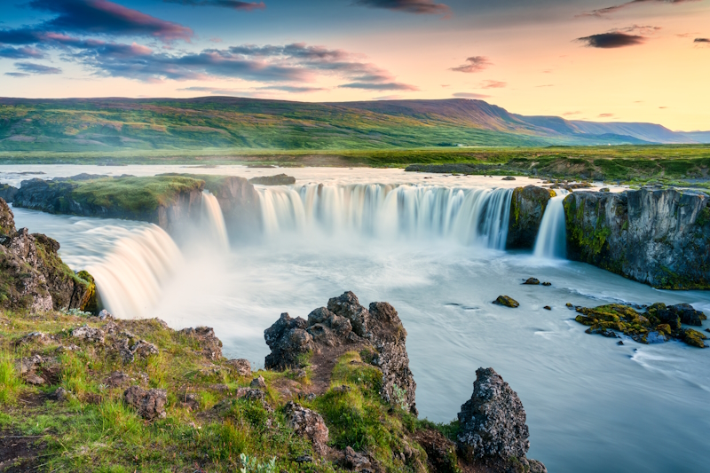 Godafoss Waterfall in Iceland shown in the summer months at sunset