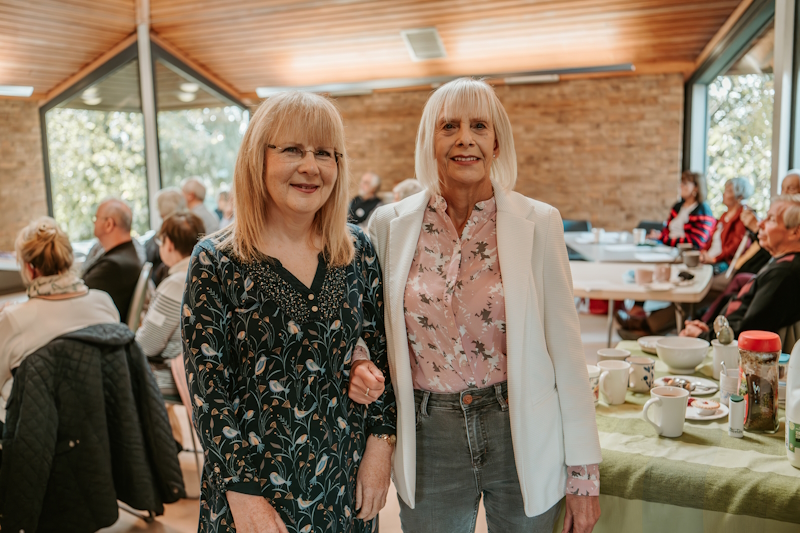 Left to right -  Derbyshire Peak members Jacqui and Eileen stood together with an event going on in the background