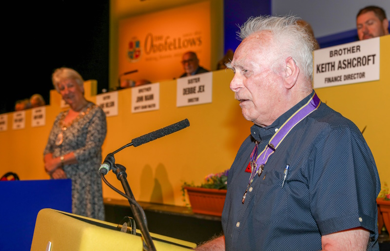 Terry speaking into a microphone