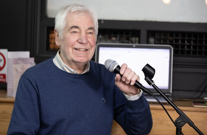 A man speaking into a microphone