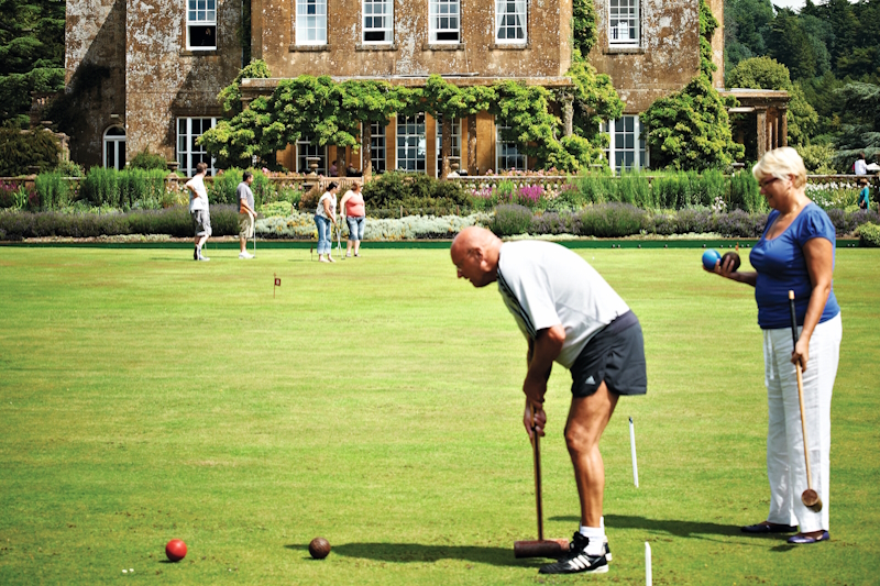 Guests playing croquet in the grounds of the hotel