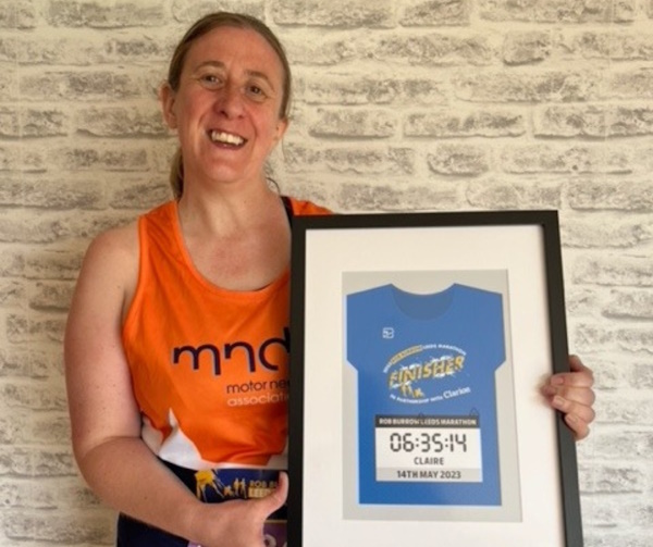 Claire smiling with her final time in a frame