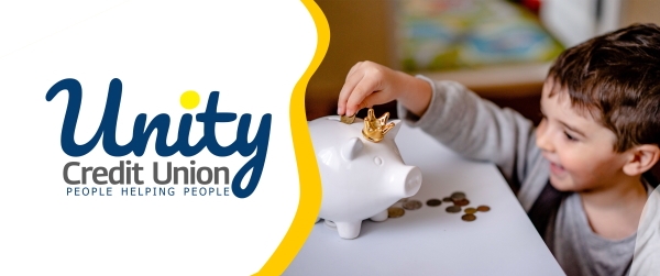 Five year old boy putting momet in a piggy bank with Unity Credit Union Logo